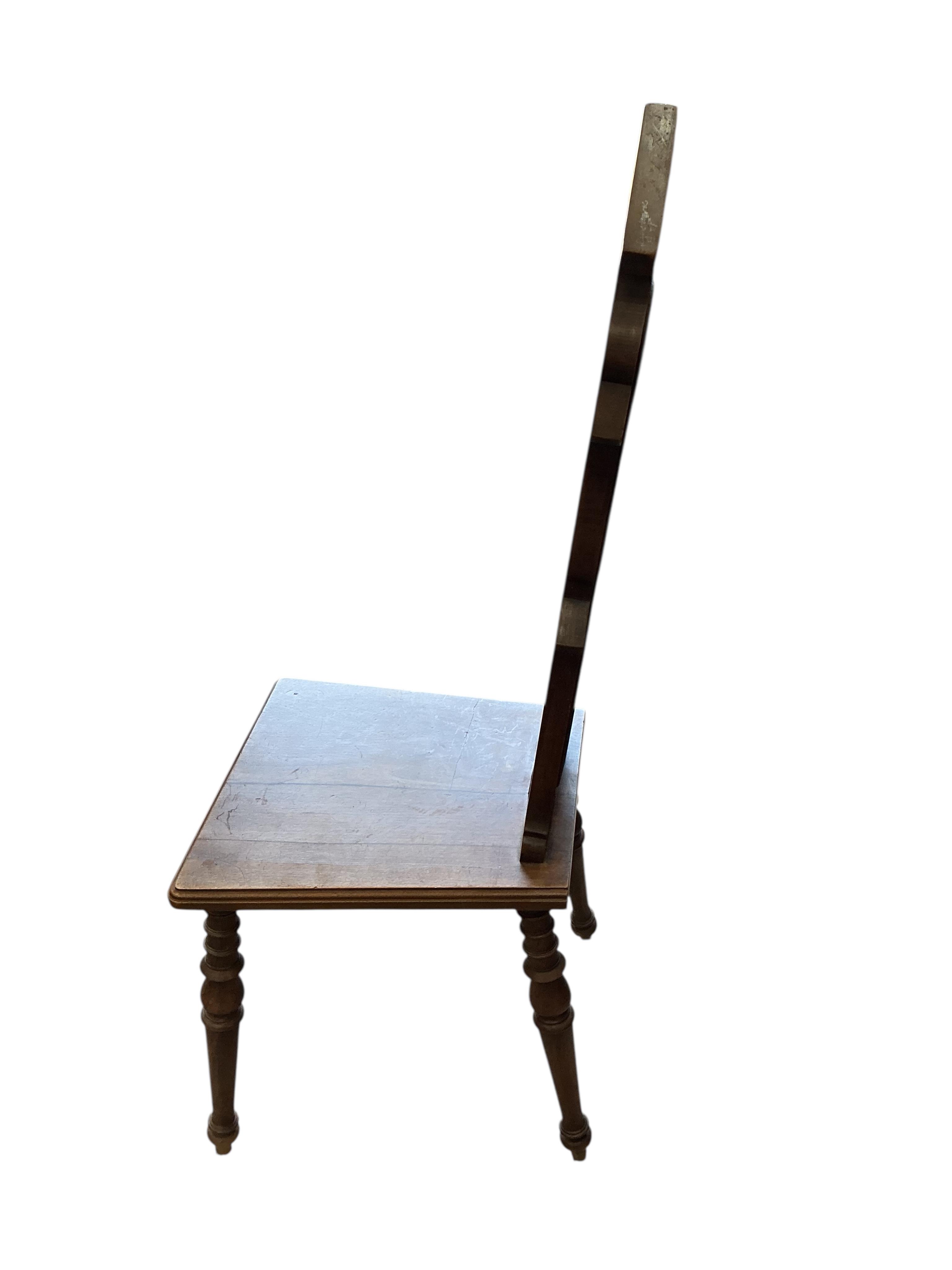A pair of early 20th century French carved walnut hall chairs, width 36cm, depth 40cm, height 108cm